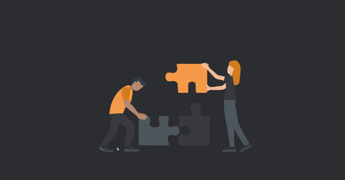 L'immagine mostra due persone che costruiscono insieme un puzzle